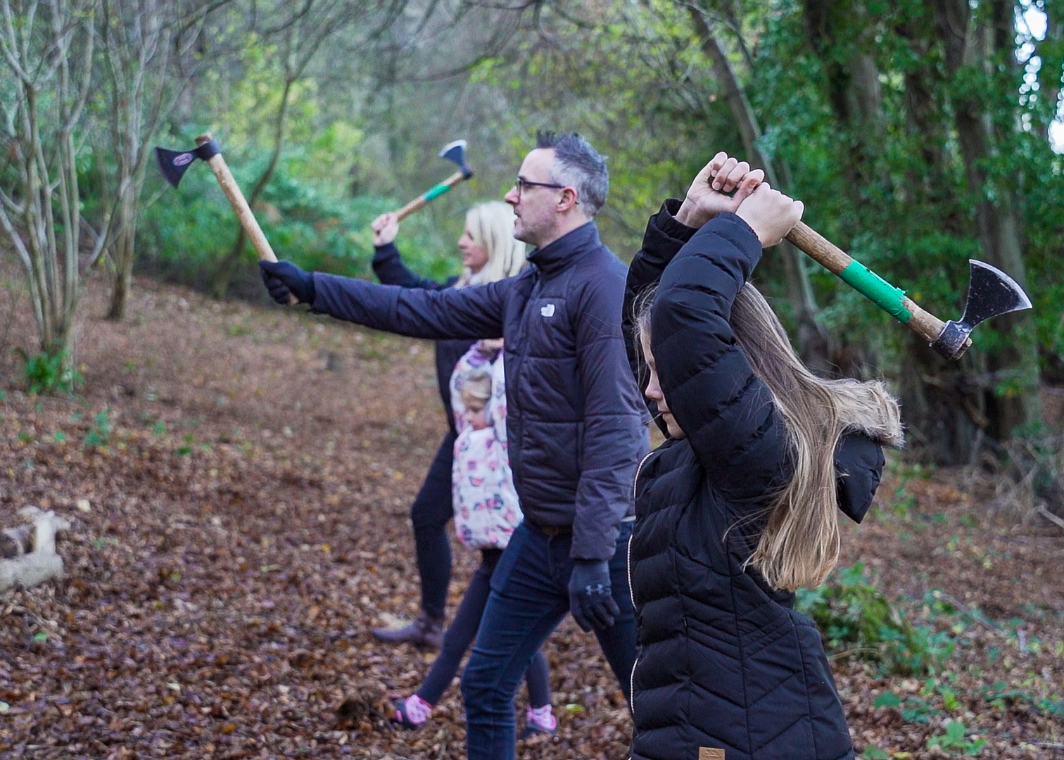 A group have a go at axe throwing